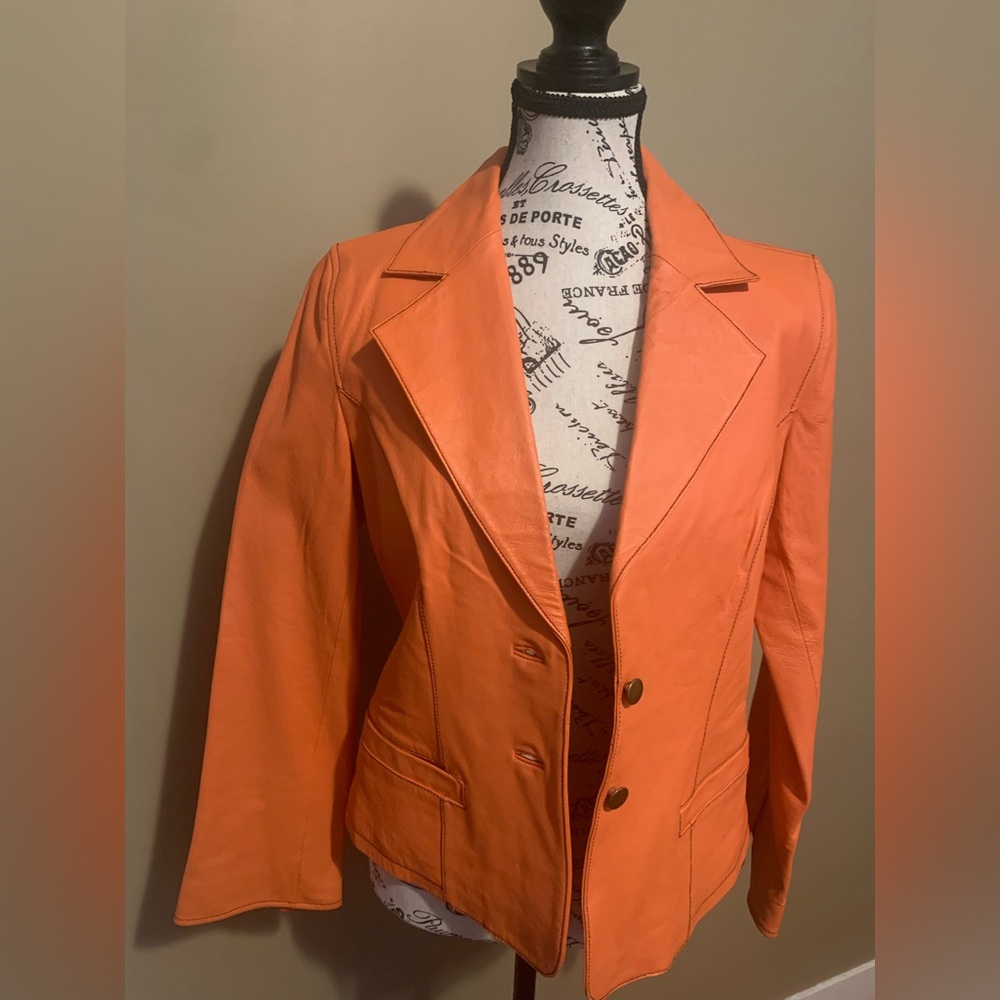 Leather jacket, medium size ,orange color , worn once
